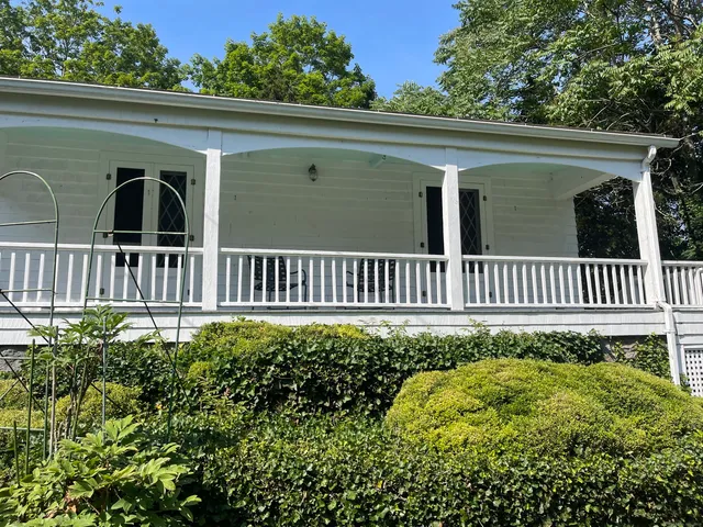 a view of a house with a small yard