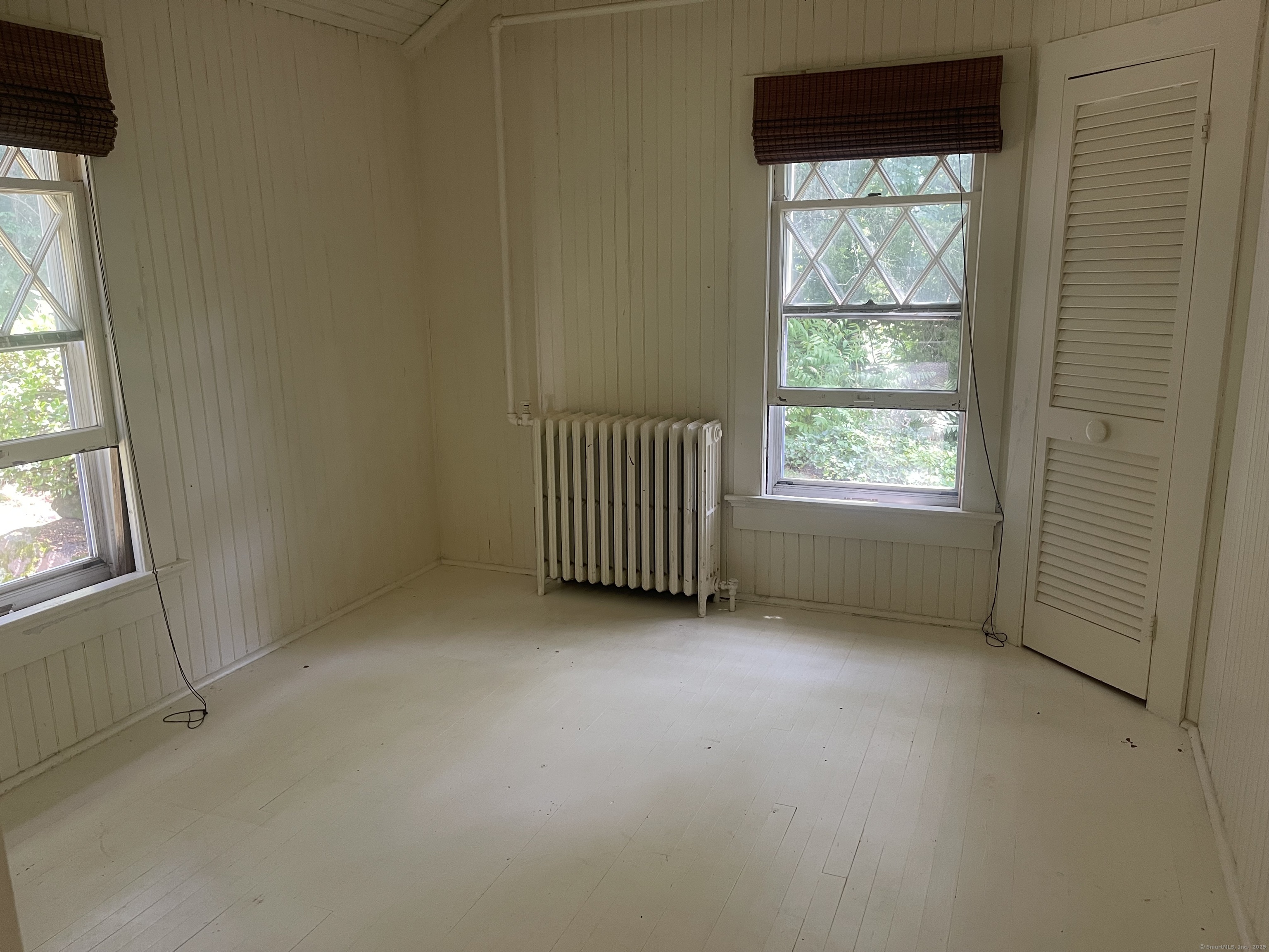 856 Boston Post Road, Unit 1 Madison, CT 06443 - Photo 6 of 25 an empty room with windows