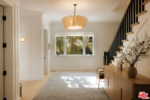 a view of entryway with a front door