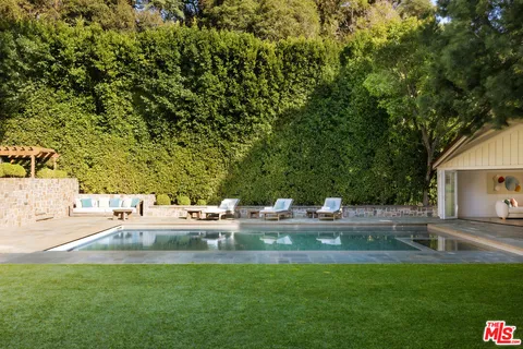a view of living room with furniture and window