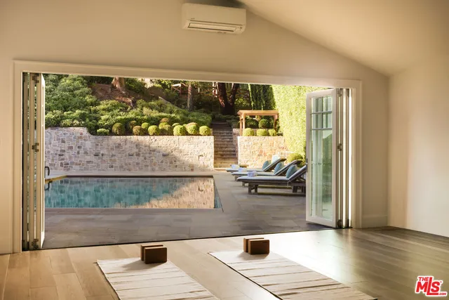 an aerial view of a house with a yard and plants