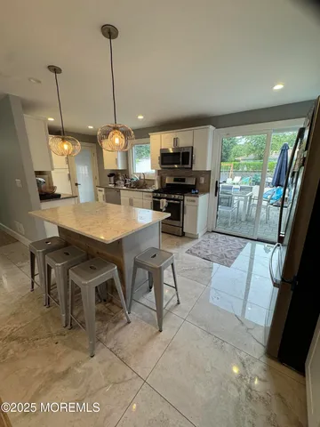 a view of kitchen and sink