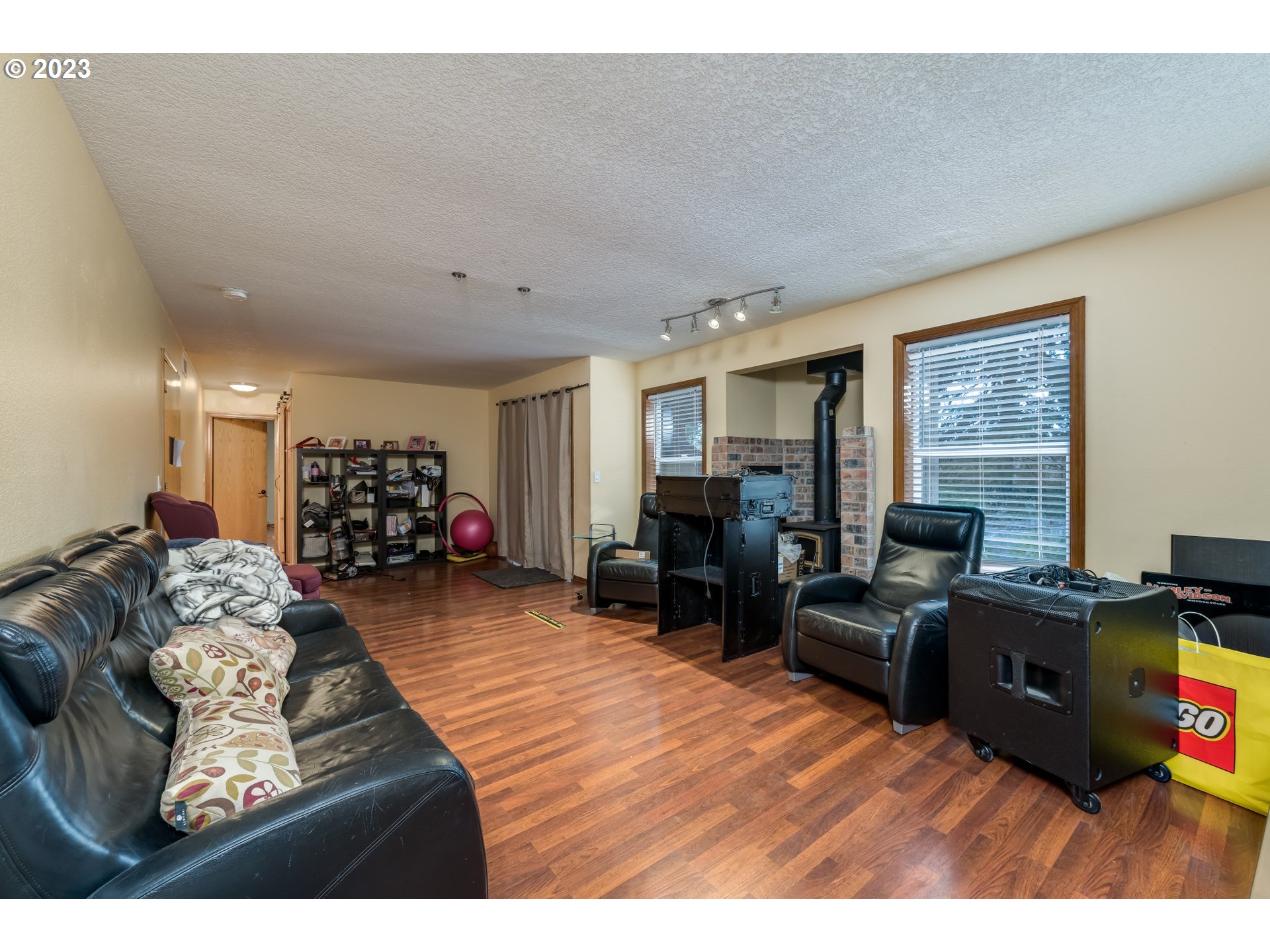 6428 Southwest 155th Avenue Beaverton, OR 97007 - Photo 17 of 24 a living room with furniture and a flat screen tv