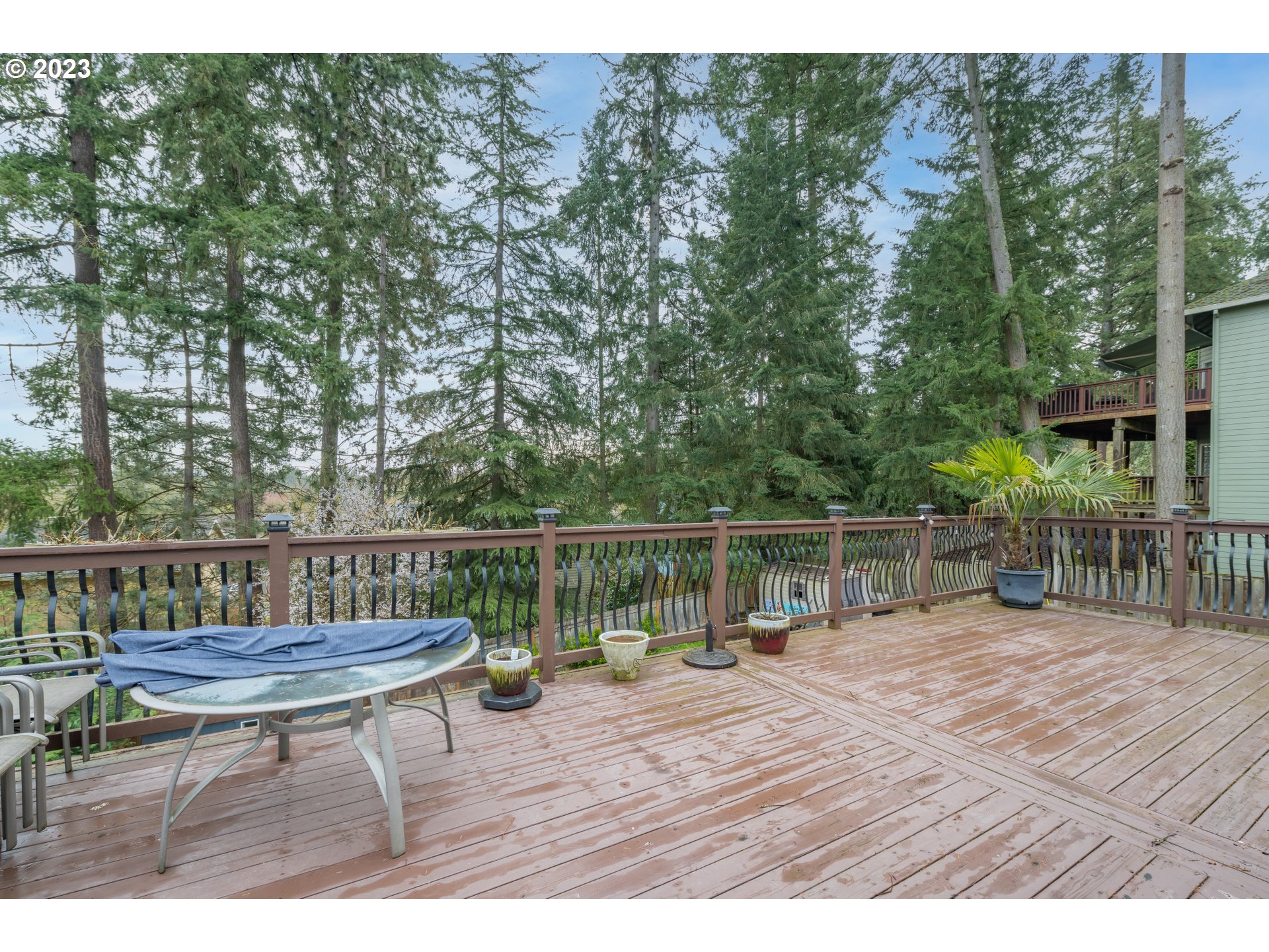 6428 Southwest 155th Avenue Beaverton, OR 97007 - Photo 21 of 24 a balcony with wooden floor table and chairs