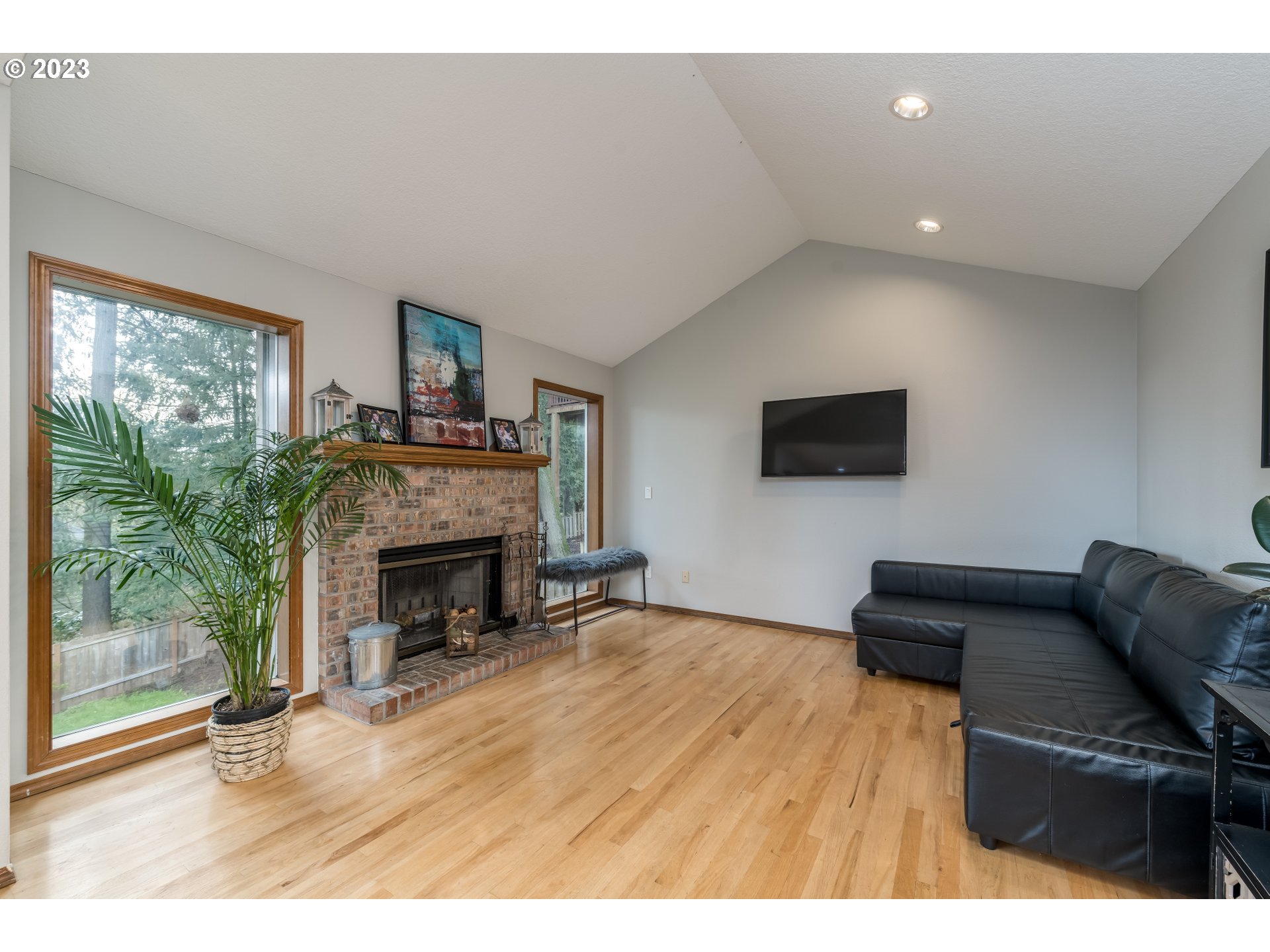 6428 Southwest 155th Avenue Beaverton, OR 97007 - Photo 5 of 24 a living room with furniture and a fireplace