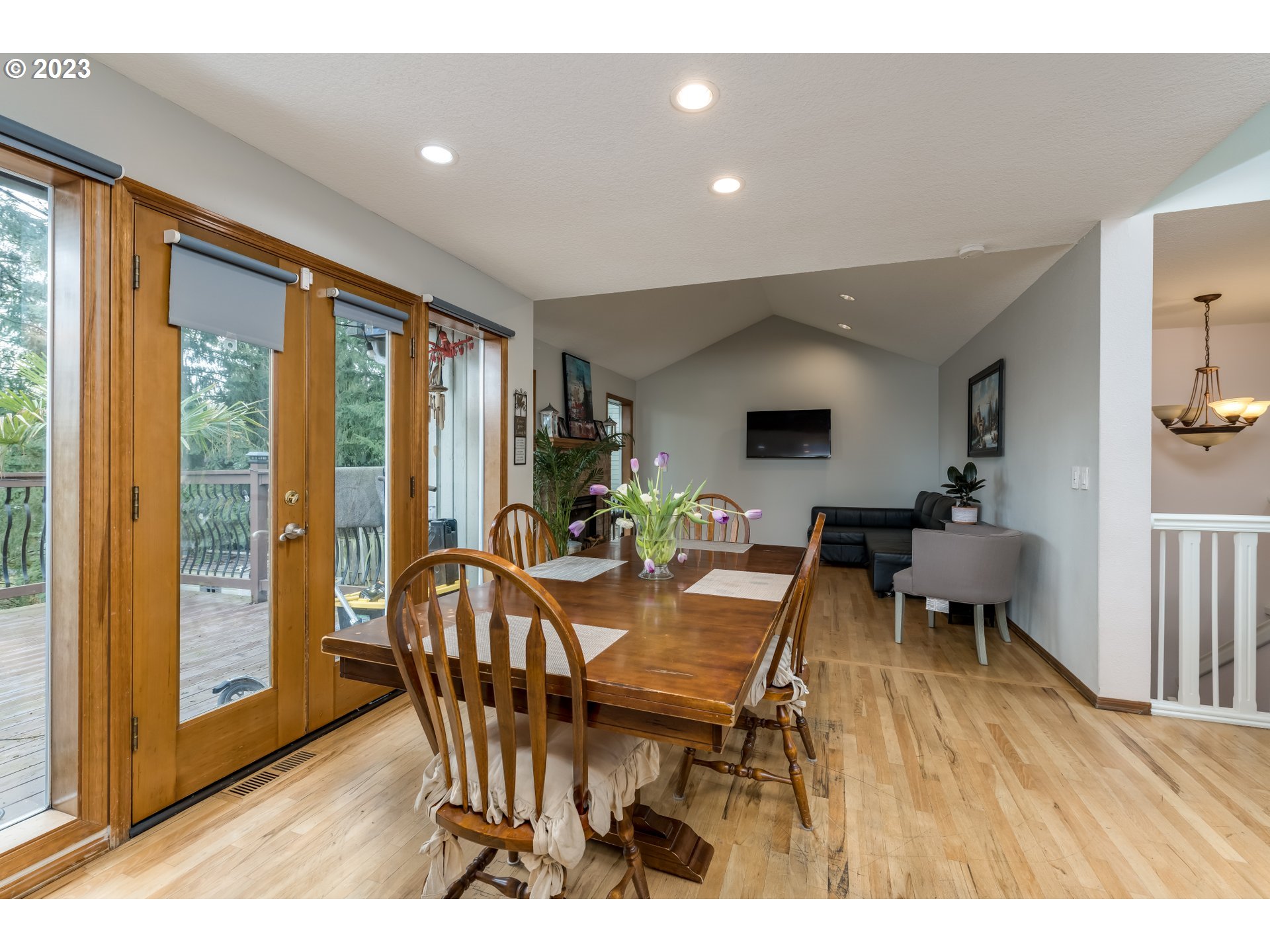 6428 Southwest 155th Avenue Beaverton, OR 97007 - Photo 6 of 24 a view of a dining room with furniture window and wooden floor