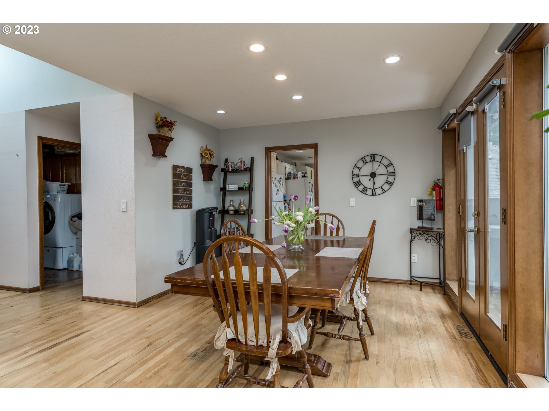 6428 Southwest 155th Avenue Beaverton, OR 97007 - Photo 7 of 24 a view of a dining room with furniture and wooden floor