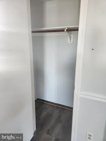 a view of an empty walk in closet