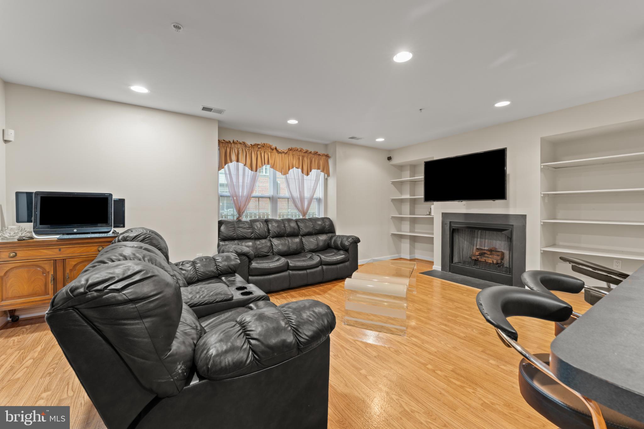 9510 Coyle Road, Unit 201 Owings Mills, MD 21117 - Photo 14 of 34 Family room with fireplace