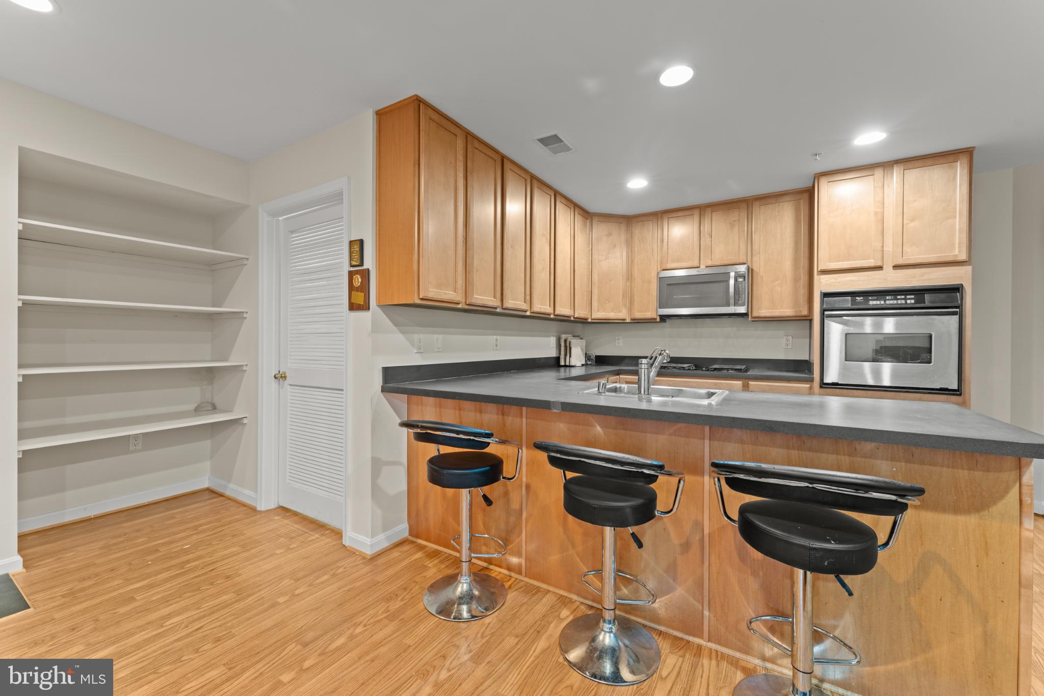 9510 Coyle Road, Unit 201 Owings Mills, MD 21117 - Photo 16 of 34 Kitchen, and laundry room door