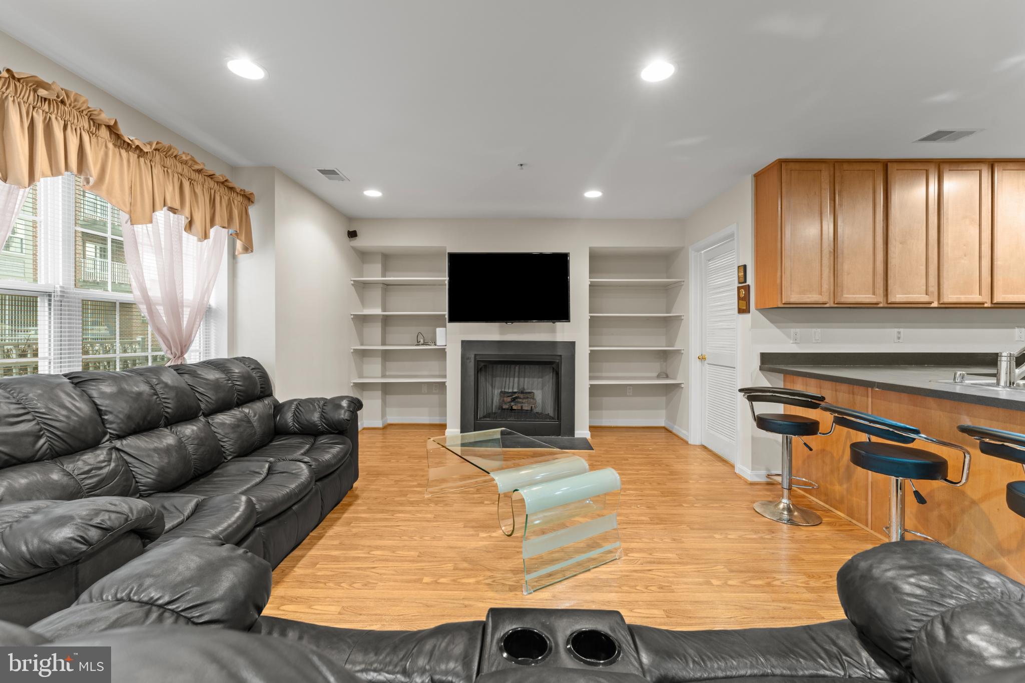 9510 Coyle Road, Unit 201 Owings Mills, MD 21117 - Photo 17 of 34 Family room with built-in's