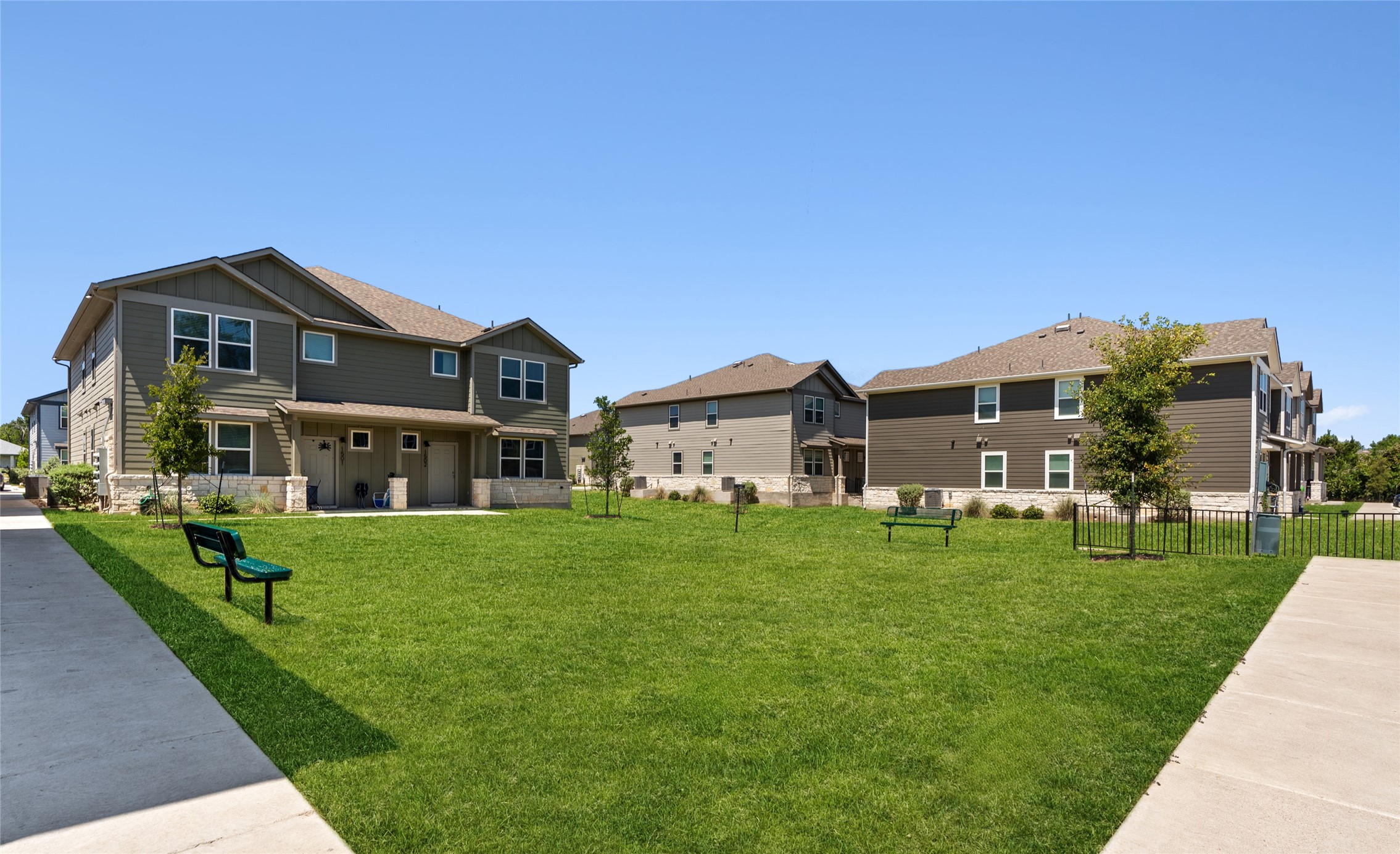 520 Powell Drive Leander, TX 78641 - Photo 2 of 32 a front view of a house with a yard table and chairs