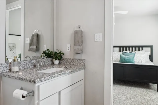 a bedroom with a bed and a dresser