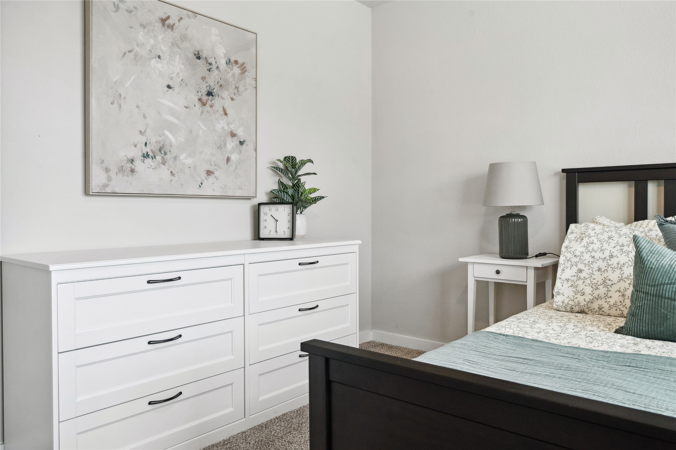 520 Powell Drive Leander, TX 78641 - Photo 28 of 32 a bedroom with a bed and a dresser
