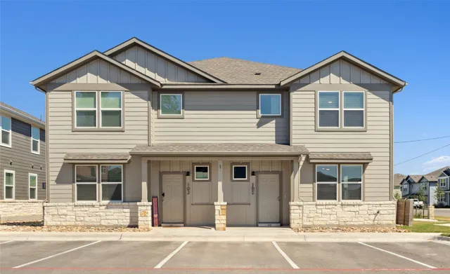 a front view of a house with a garage
