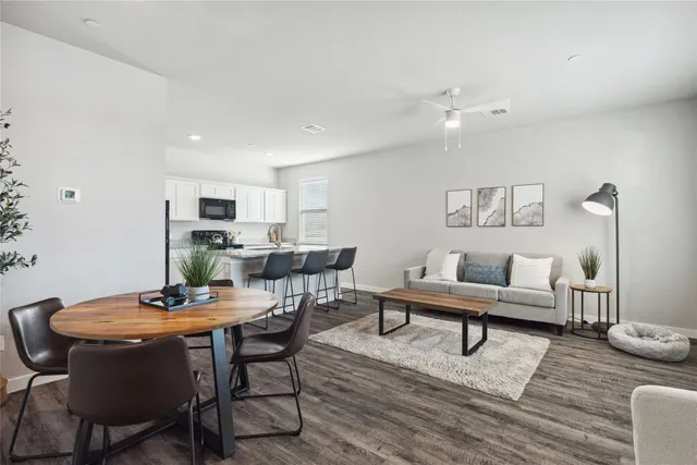 a living room with furniture and a table