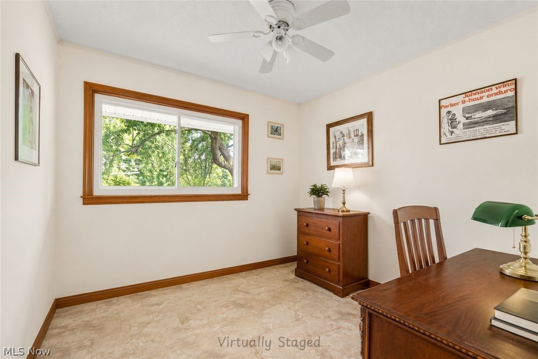 16107 Moseley Road Madison, OH 44057 - Photo 18 of 40 Room with light-colored walls and a window with wood trim