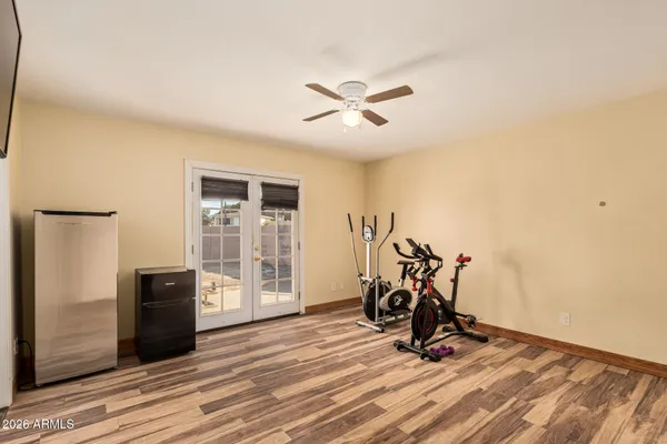 a view of a livingroom with furniture and a ceiling fan