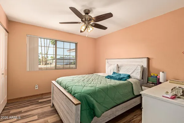 a bedroom with a bed and window