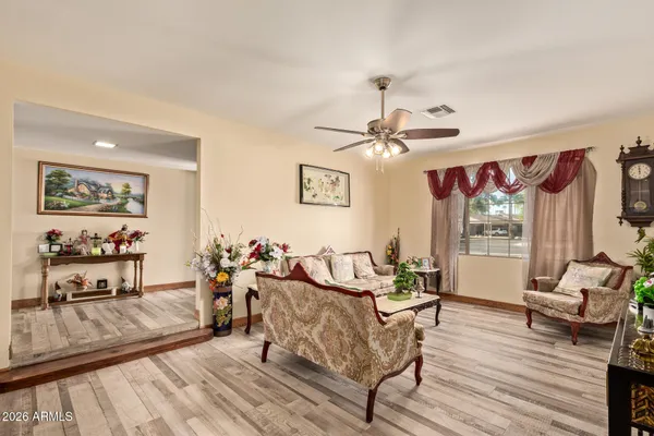 a living room with furniture and a large window