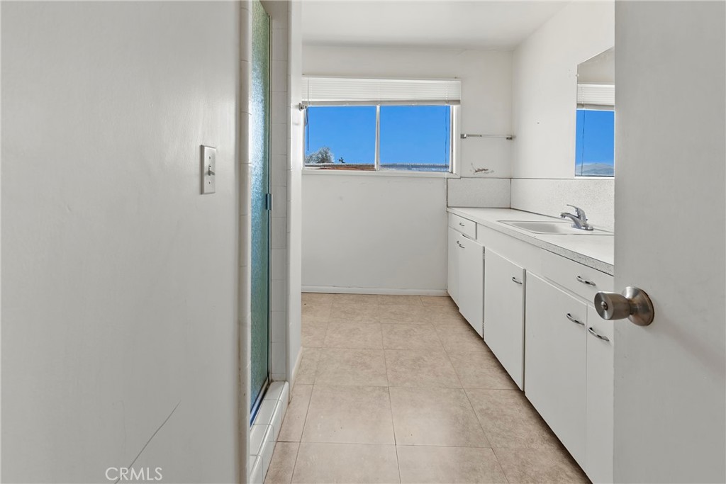 117 West El Campo Road Arroyo Grande, CA 93420 - Photo 14 of 43 a kitchen with a refrigerator and a sink