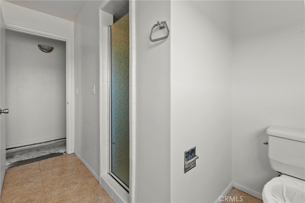 117 West El Campo Road Arroyo Grande, CA 93420 - Photo 15 of 43 a bathroom with a toilet and a shower