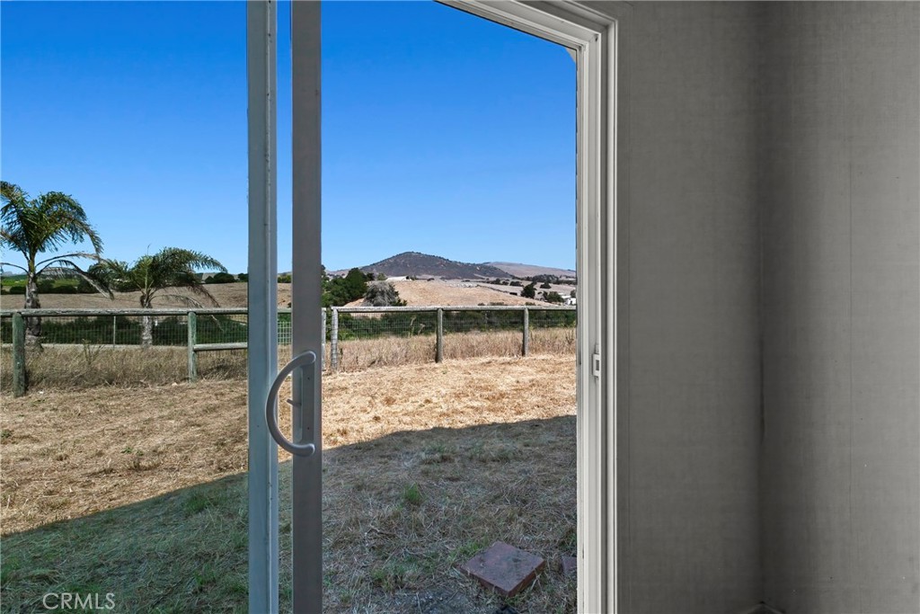 117 West El Campo Road Arroyo Grande, CA 93420 - Photo 22 of 43 a view of a glass door and a yard
