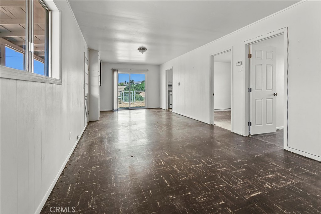 117 West El Campo Road Arroyo Grande, CA 93420 - Photo 10 of 43 a view of a hallway with wooden floor and a window