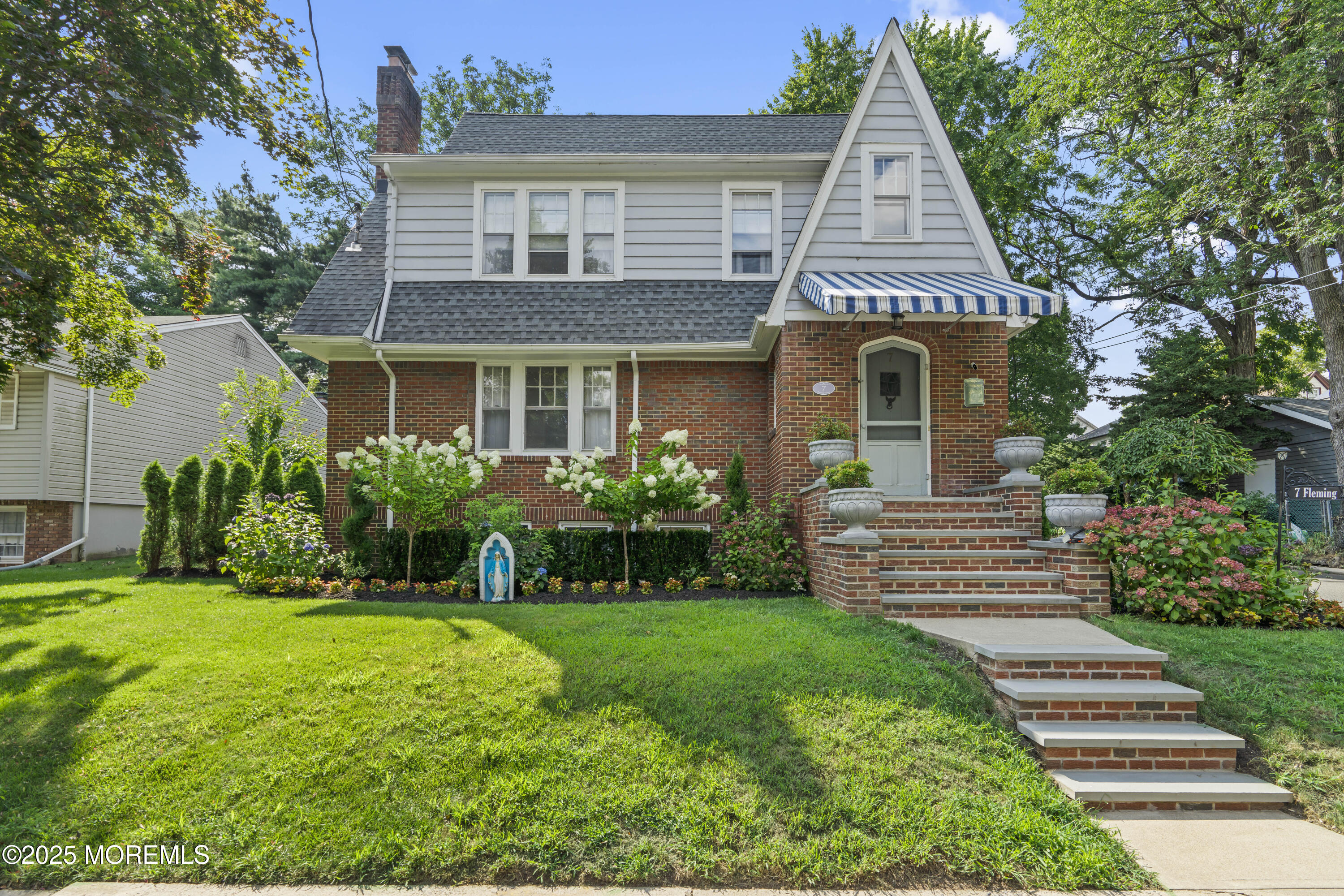 7 Fleming Terrace Maplewood, NJ 07040 - Photo 1 of 72 a front view of a house with a yard