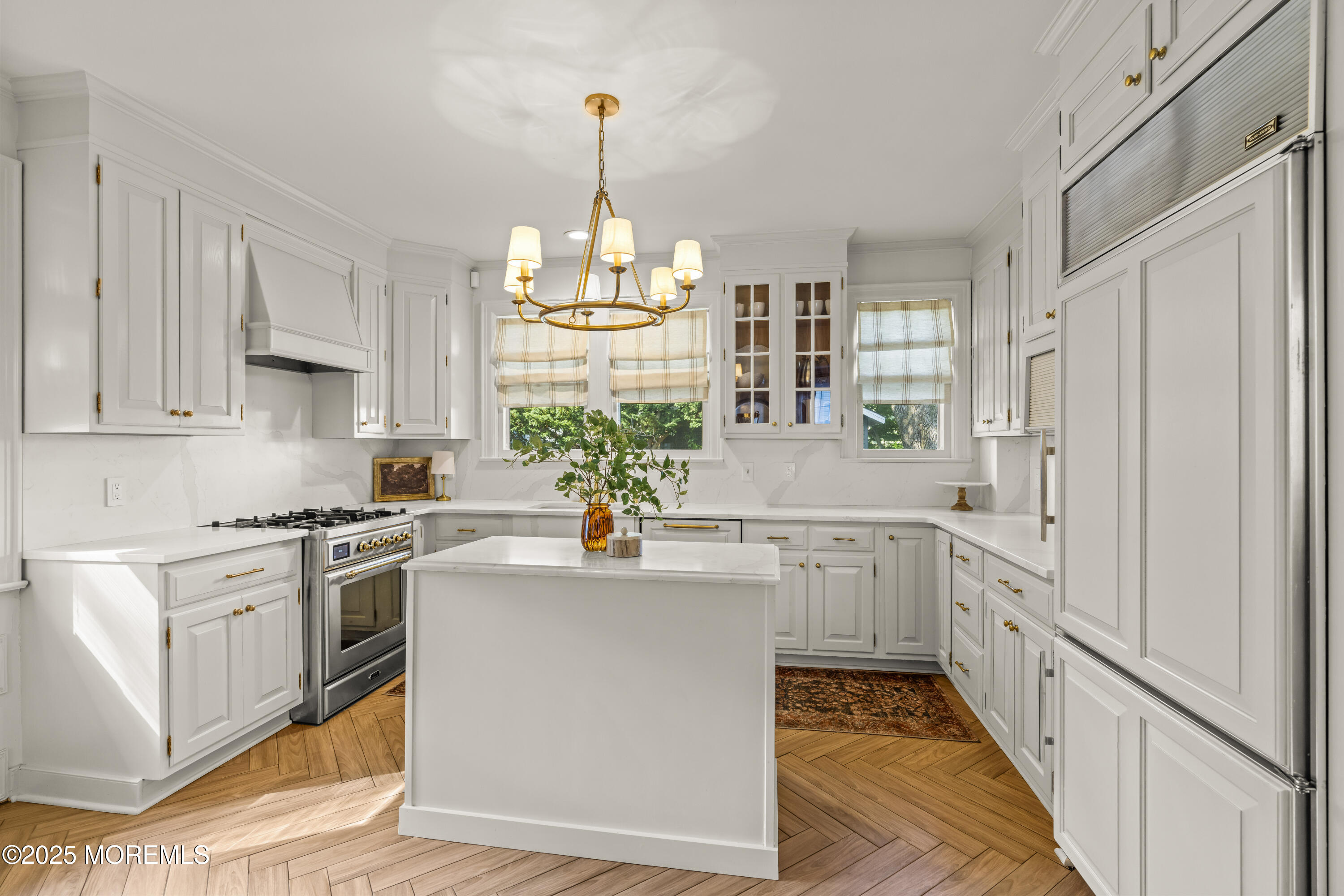 7 Fleming Terrace Maplewood, NJ 07040 - Photo 22 of 72 a kitchen with white cabinets and appliances