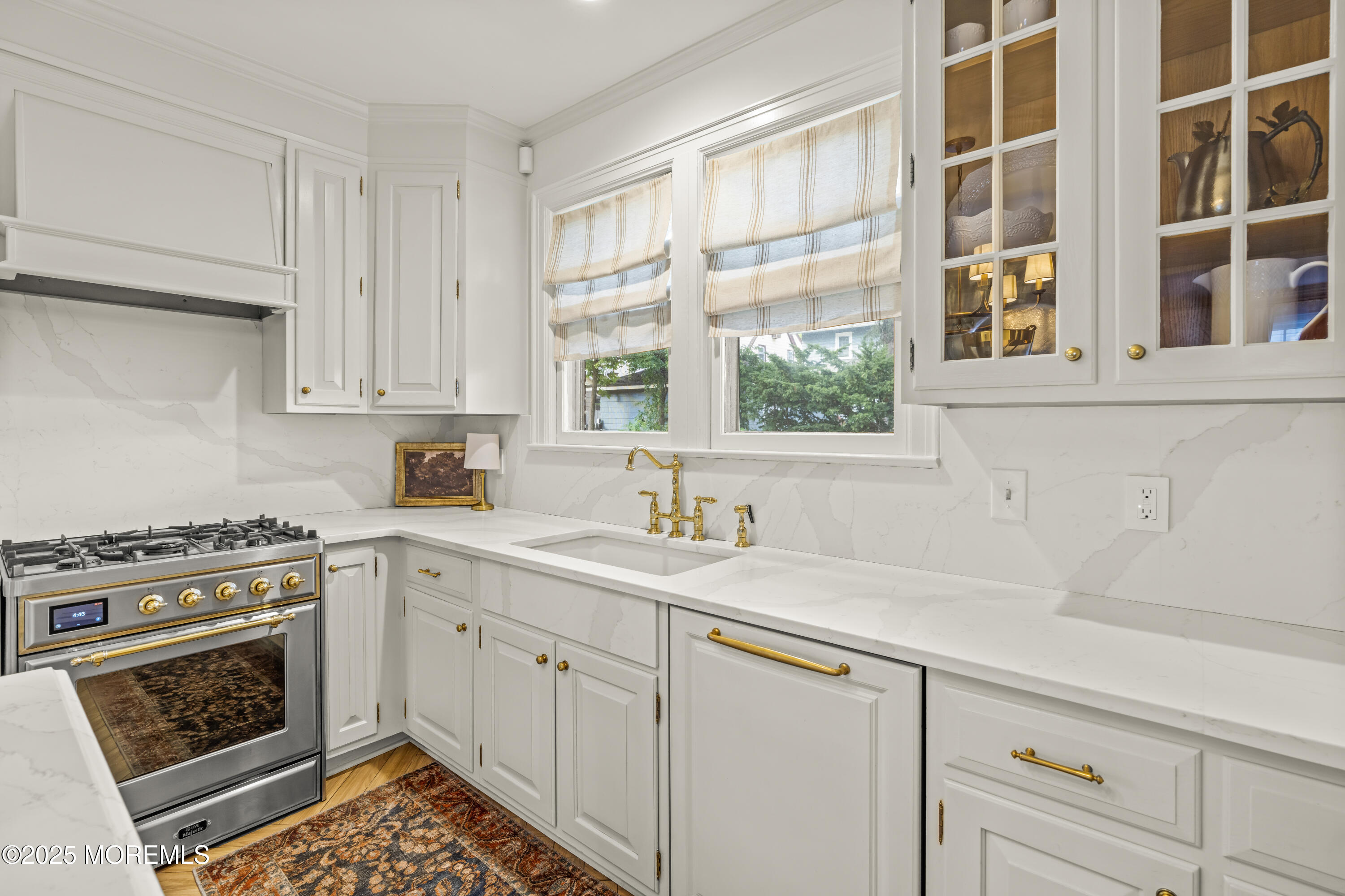 7 Fleming Terrace Maplewood, NJ 07040 - Photo 24 of 72 a kitchen with a sink stove and cabinets