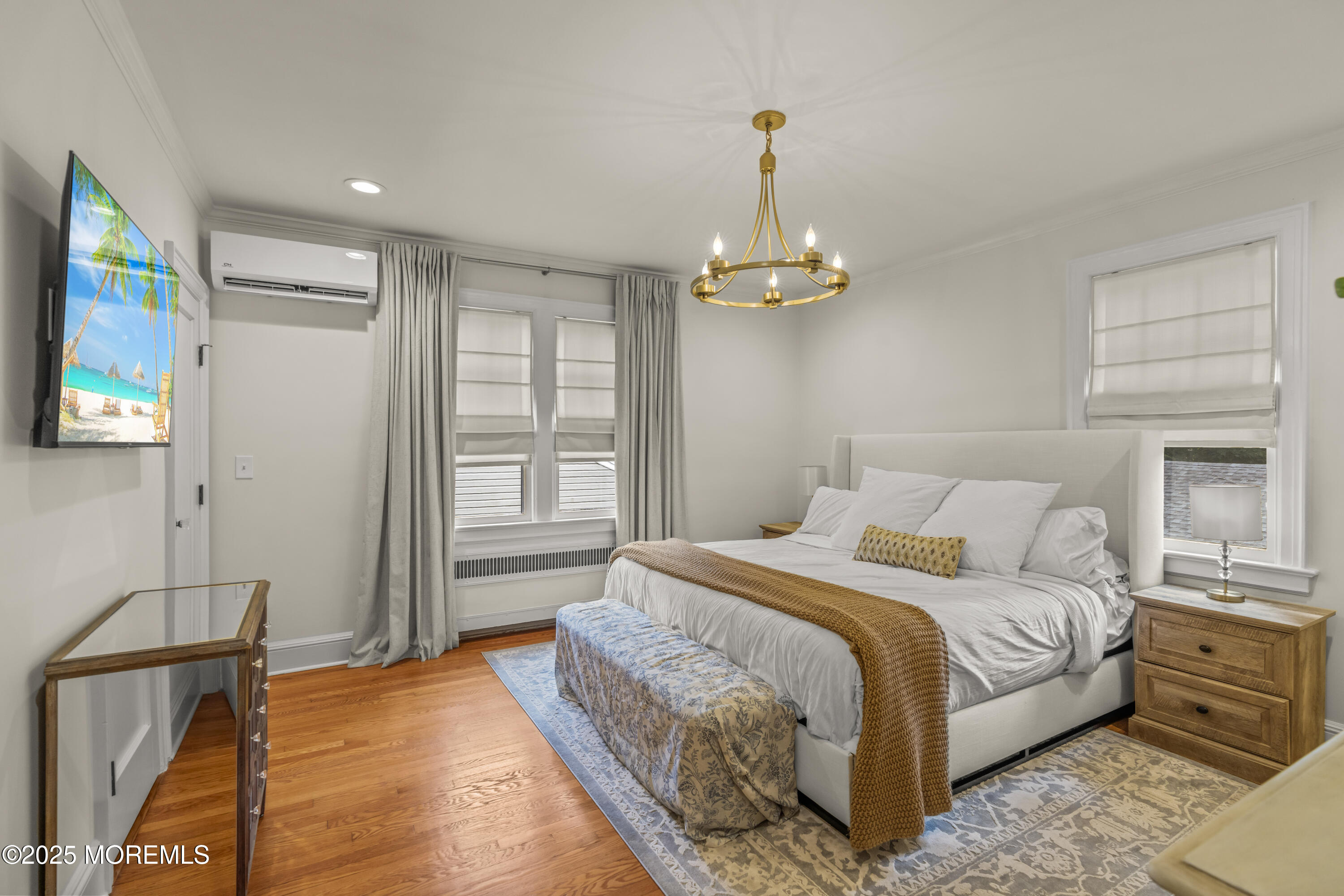 7 Fleming Terrace Maplewood, NJ 07040 - Photo 29 of 72 a spacious bedroom with a bed and dresser with wooden floor