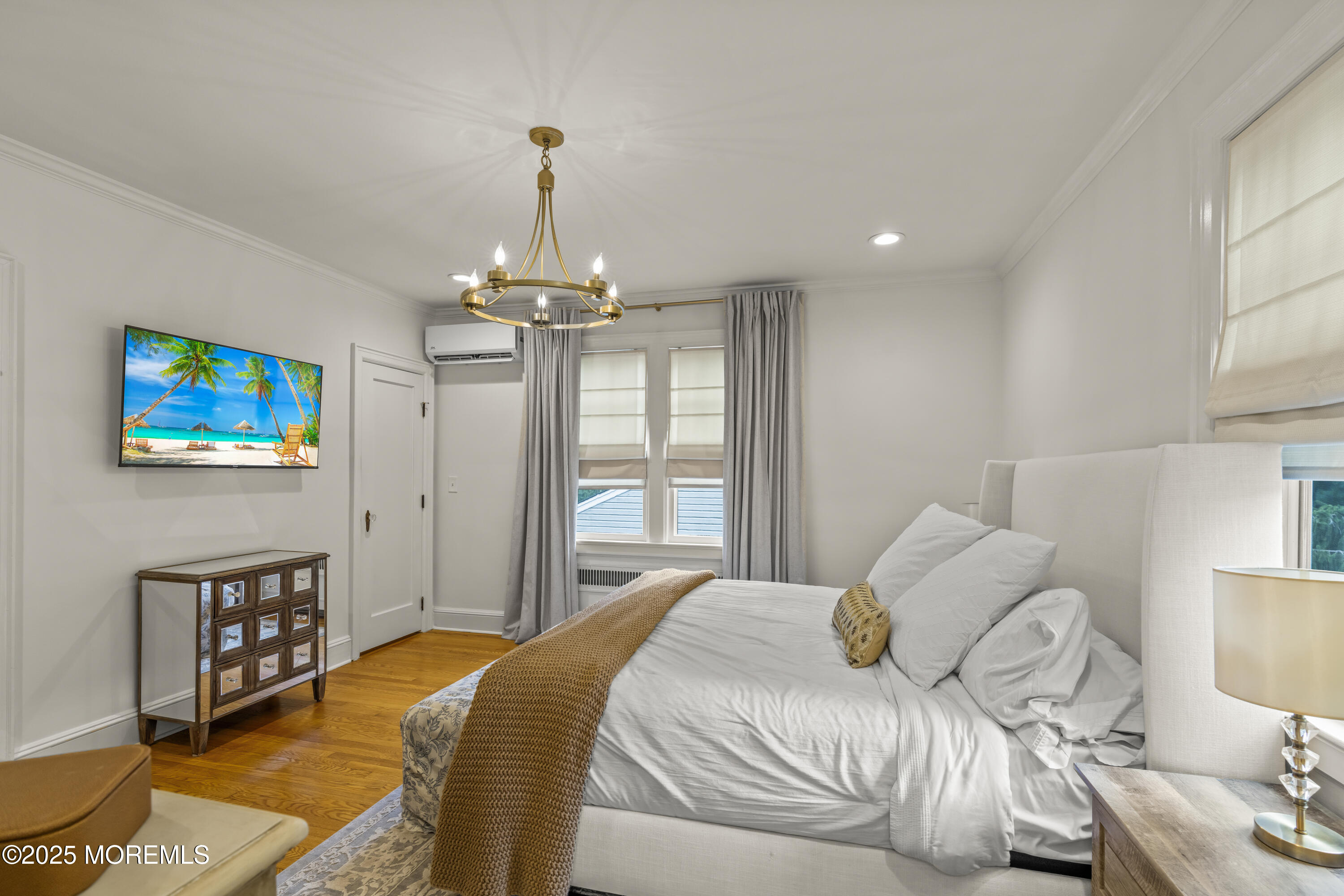 7 Fleming Terrace Maplewood, NJ 07040 - Photo 30 of 72 a bedroom with a bed and a chandelier