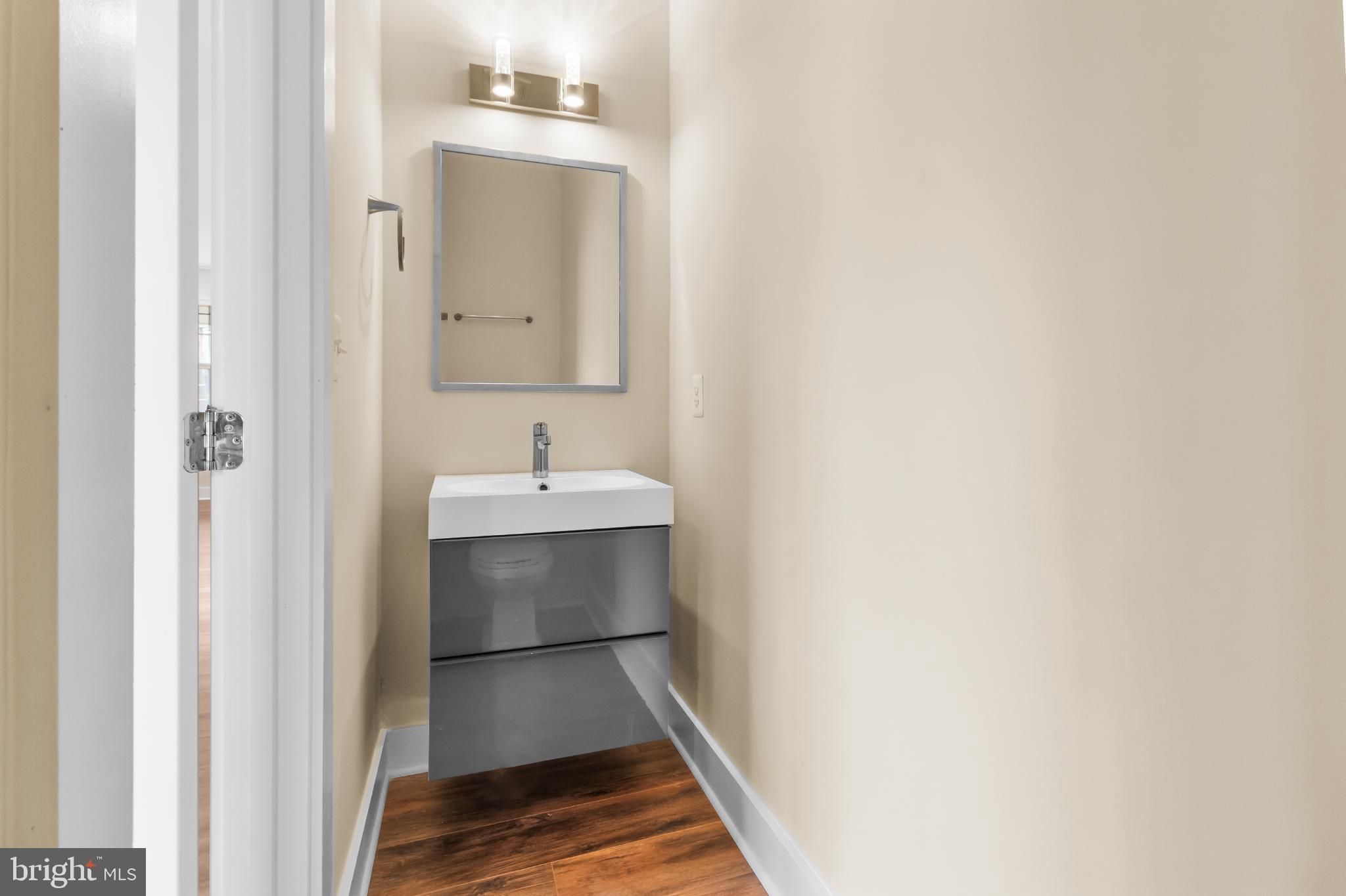 2405 Naylor Road Southeast Washington, DC 20020 - Photo 18 of 20 Sleek modern half-bath with stylish fixtures.