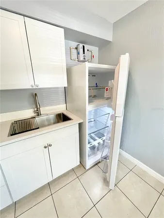 a view of an empty room and a window