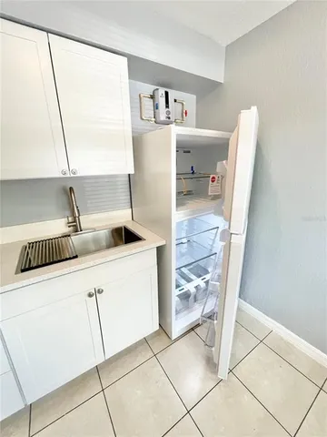 a view of an empty room and a window