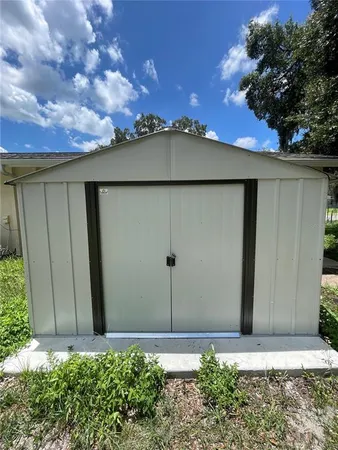 a kitchen with a stove a sink and a refrigerator