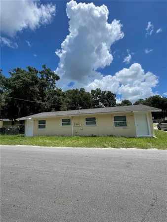 a view of a room with a white wall and a window