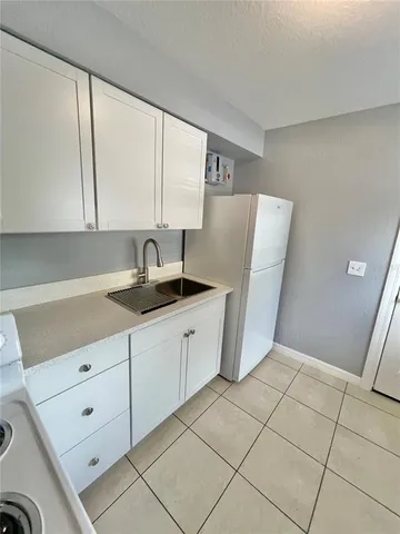 a kitchen with a sink and washing machine