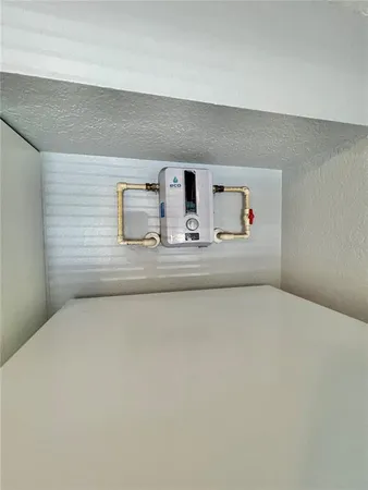 a kitchen with a refrigerator and a sink