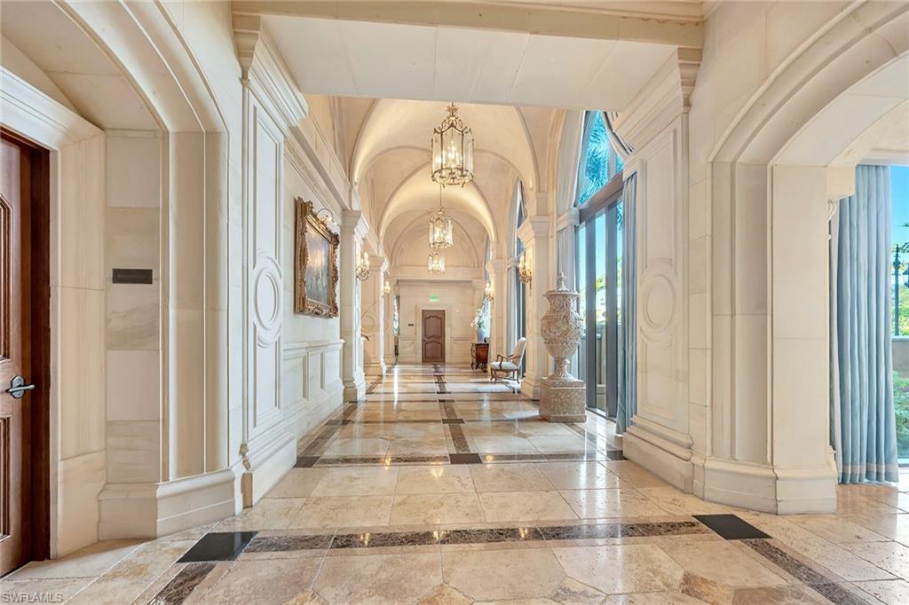 6597 Nicholas Boulevard, Unit 1002 Naples, FL 34108 - Photo 2 of 41 a view of a hallway with windows and stairs