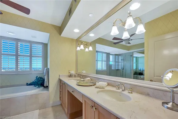 a bathroom with a double vanity sink and a mirror