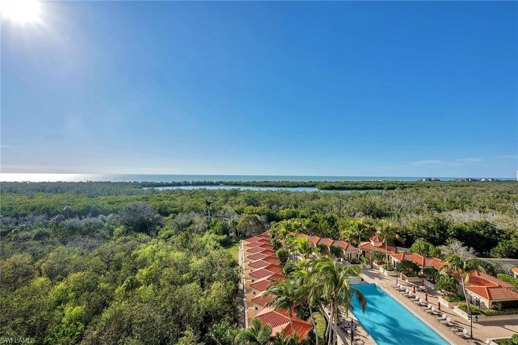 6597 Nicholas Boulevard, Unit 1002 Naples, FL 34108 - Photo 6 of 41 an aerial view of residential houses with outdoor space and trees