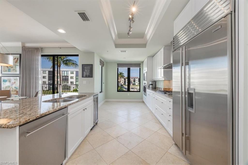 1490 5th Avenue South, Unit 200B Naples, FL 34102 - Photo 16 of 43 Kitchen featuring Wolf and Sub-Zero appliances and wine fridge