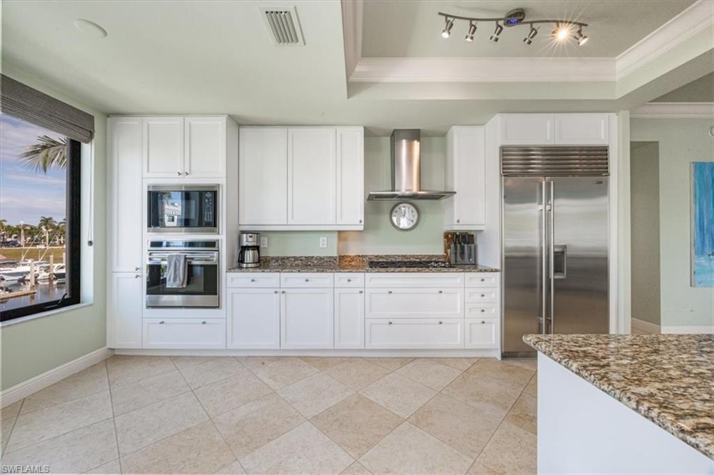 1490 5th Avenue South, Unit 200B Naples, FL 34102 - Photo 17 of 43 Kitchen featuring Wolf and Sub-Zero appliances and wine fridge