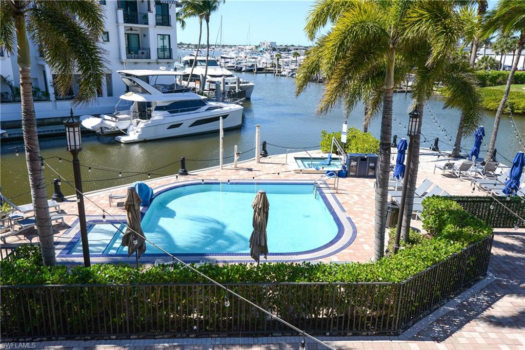 1490 5th Avenue South, Unit 200B Naples, FL 34102 - Photo 4 of 43 View of pool and Naples Bay