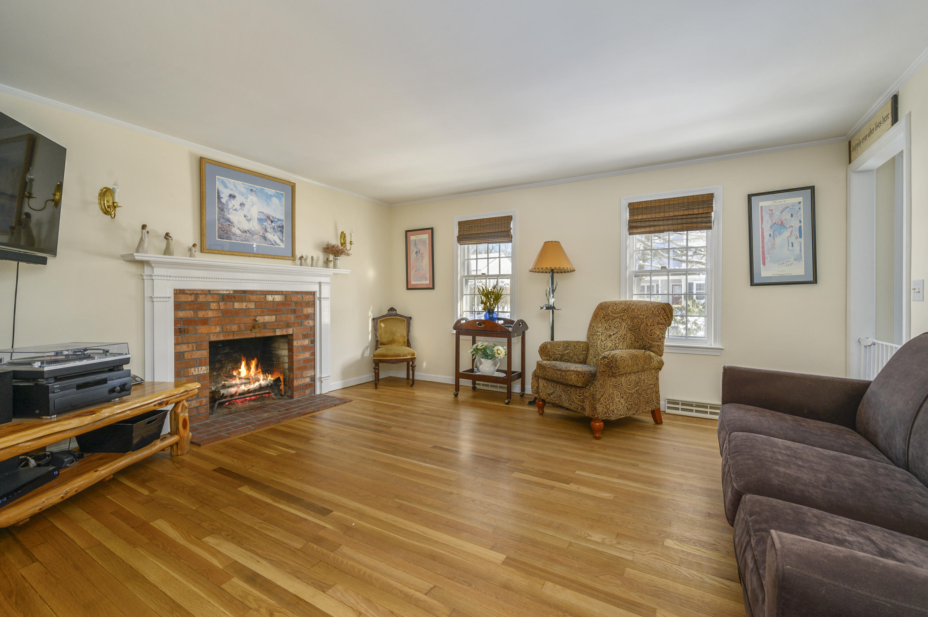 8 Ruth Lane Harwich, MA 02645 - Photo 3 of 20 a living room with furniture and a fireplace