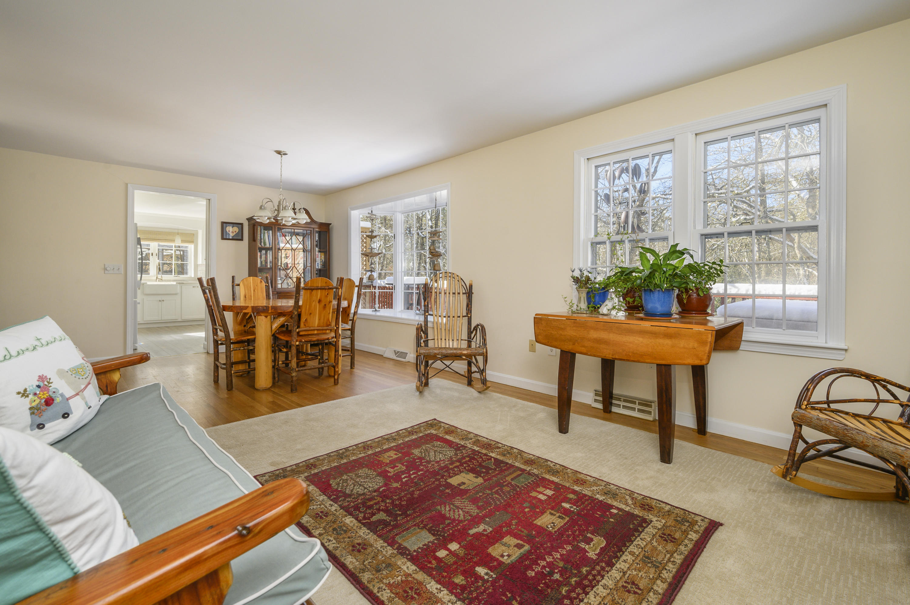 8 Ruth Lane Harwich, MA 02645 - Photo 4 of 20 a living room with furniture a rug a lamp and a window
