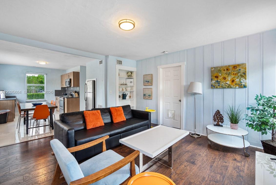 2255 Southwest 10th Street, Unit B Miami, FL 33135 - Photo 9 of 26 a living room with furniture and wooden floor