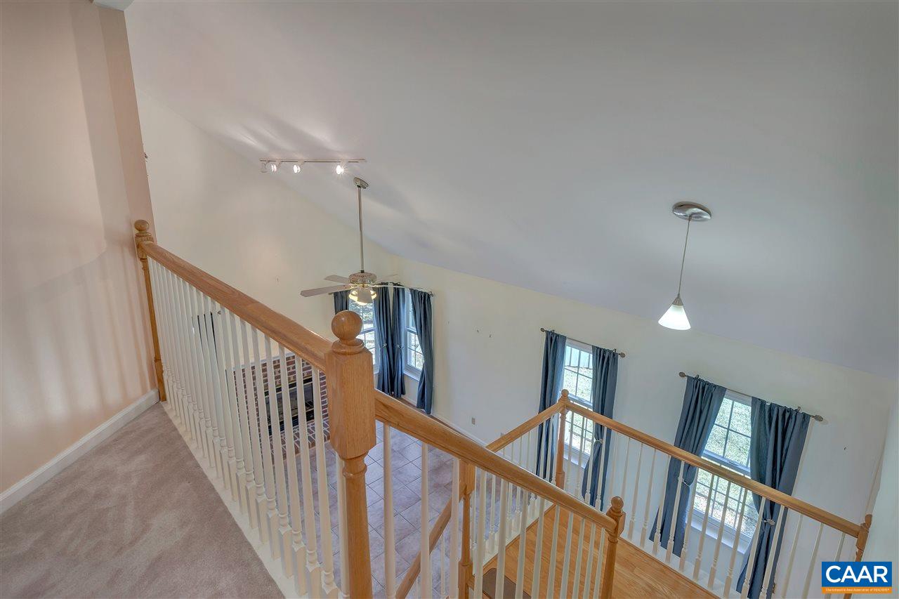 4753 Clover Ridge Court Charlottesville, VA 22901 - Photo 14 of 24 a view of staircase with railing and a chandelier